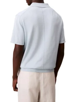 Polo en coton bleu ciel uni à coupe légèrement oversize avec le logo brodé