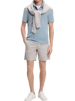 Polo en coton bleu à coupe droite pourvu d'un col côtelé boutonné
