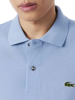Polo en coton bleu à coupe droite pourvu d'un col à revers boutonné