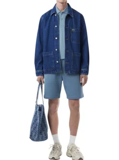 Polo en coton bleu en maille piquée avec une coupe droite et un col à revers