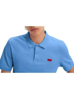 Polo en coton bleu en maille piquée avec une coupe slim et un col boutonné