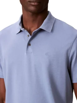 Polo en coton bleu uni avec une coupe droite et un col boutonné