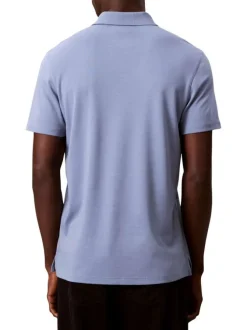 Polo en coton bleu uni avec une coupe droite et un col boutonné
