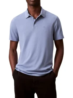 Polo en coton bleu uni avec une coupe droite et un col boutonné