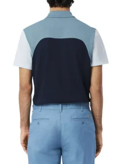 Polo en coton bleu uni avec une coupe droite et un col français