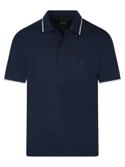 Polo en coton bleu uni avec une coupe droite et un col à revers