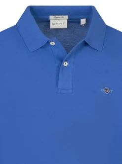 Polo en coton bleu uni à coupe ajustée avec col boutonné et des manches longues