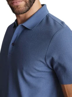 Polo en coton bleu uni à coupe regular fit avec des motifs piqués ton sur ton