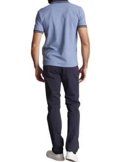Polo en coton bleu uni à coupe slim avec un col à revers fermé par des pressions