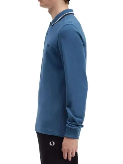 Polo en coton bleu uni à manches longues avec liserés sur le col français