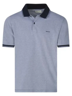 Polo en coton bleu uni piqué avec une coupe droite et un col à revers