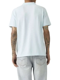 Polo en coton ciel uni avec une coupe droite et un col boutonné