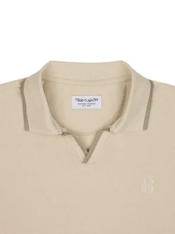 Polo en coton écru uni à coupe droite et à col v à revers avec des liserés