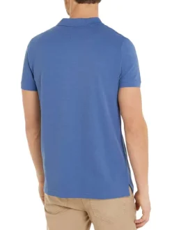 Polo en coton indigo uni avec un col boutonné et une coupe droite
