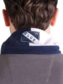 Polo en coton marine tricolore avec une coupe droite et un col à revers
