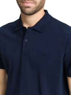 Polo en coton marine uni avec une coupe droite et un col boutonné