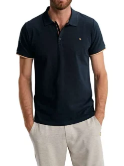 Polo en coton marine uni pourvu de manches courtes et d'un col boutonné