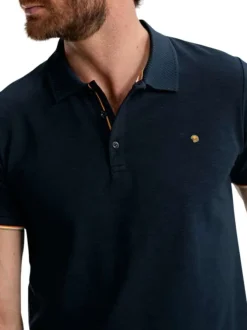 Polo en coton marine uni pourvu de manches courtes et d'un col boutonné