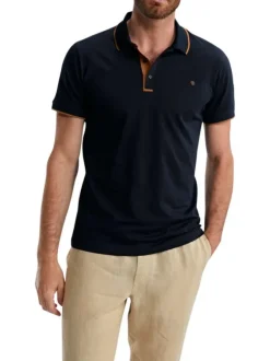 Polo en coton marine uni pourvu de manches courtes et d'un col boutonné