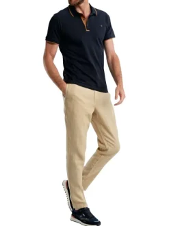 Polo en coton marine uni pourvu de manches courtes et d'un col boutonné