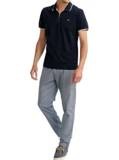 Polo en coton marine uni pourvu de manches courtes et d'un col zippé