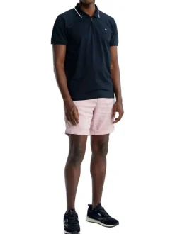 Polo en coton marine uni pourvu d'un col zippé et de manches courtes