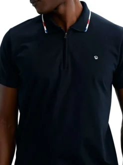 Polo en coton marine uni pourvu d'un col zippé et de manches courtes