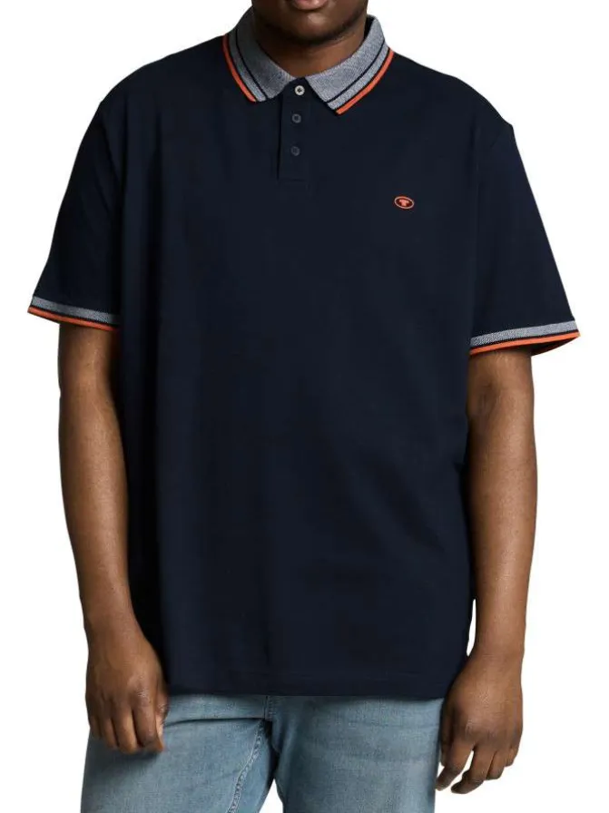 Polo en coton marine uni pourvu d'une coupe droite et d'un col boutonné
