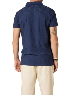 Polo en coton marine uni pourvu d'une coupe droite et d'un col boutonné