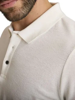 Polo en coton mélangé écru à coupe droite pourvu d'un col boutonné