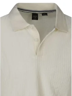 Polo en coton mélangé écru uni avec une coupe droite et un col boutonné