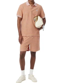 Polo en coton mélangé orange à rayures pourvu d'un col boutonné