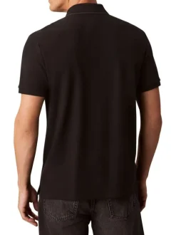 Polo en coton noir à coupe droite pourvu d'un col à revers boutonné