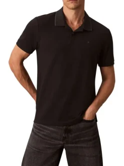 Polo en coton noir à coupe droite pourvu d'un col à revers boutonné