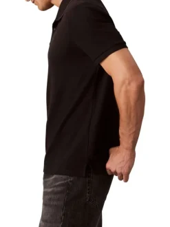 Polo en coton noir à coupe droite pourvu d'un col à revers boutonné