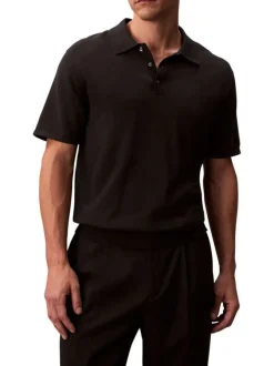 Polo en coton noir à coupe droite pourvu d'un col à revers boutonné