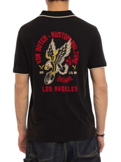 Polo en coton noir uni avec une coupe droite et un col boutonné