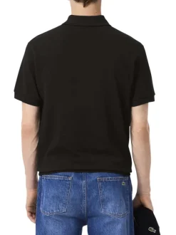 Polo en coton noir uni avec une coupe droite et un col boutonné