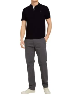 Polo en coton noir uni coupe droite avec un col boutonné et en maille piquée