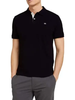 Polo en coton noir uni coupe droite avec un col boutonné et en maille piquée