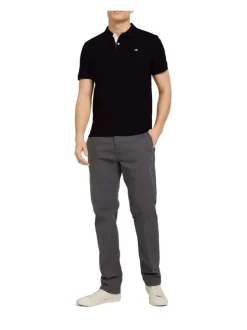 Polo en coton noir uni coupe droite avec un col boutonné et en maille piquée