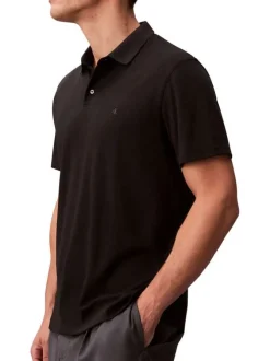 Polo en coton noir uni à coupe regular fit avec le mini logo brodé