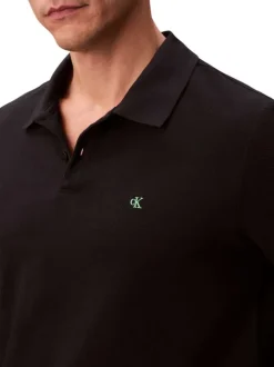 Polo en coton noir uni à coupe slim avec le logo brodé en petit