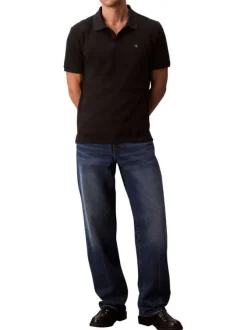 Polo en coton noir uni à coupe slim avec le logo brodé en petit