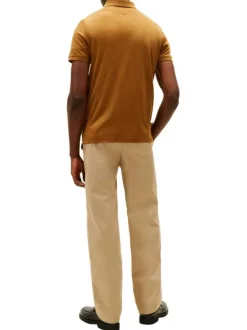 Polo en coton orange à coupe ajustée pourvu d'un col boutonné