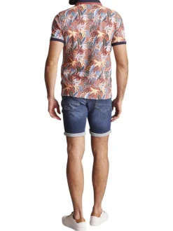 Polo en coton orange fleuri à coupe slim fit et à col fermé par trois boutons