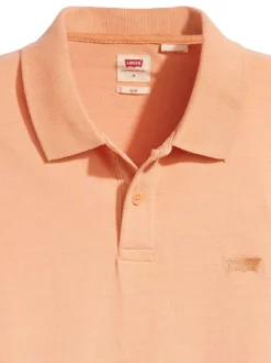 Polo en coton orange uni avec un col boutonné et une coupe droite