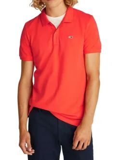 Polo en coton régénératif orange uni avec une coupe droite, col boutonné et logo