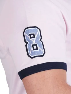 Polo en coton rose en maille piquée avec une coupe droite et un col à revers