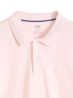 Polo en coton rose uni avec une coupe droite et un col boutonné
